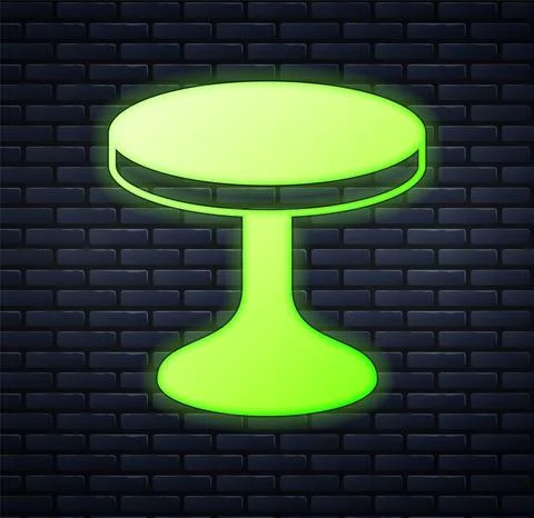 Glowing neon Round table icon isolated on brick wall background. Vector Illustrazione stock