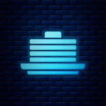 Glowing neon Stack of pancakes icon isolated on brick wall background. Baking 스톡 일러스트