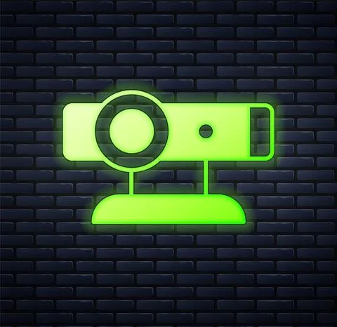 Glowing neon Web camera icon isolated on brick wall background. Chat camera 스톡 일러스트