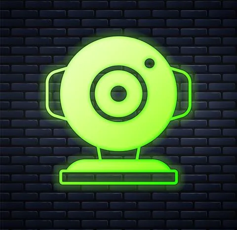 Glowing neon Web camera icon isolated on brick wall background. Chat camera Stockillustratie