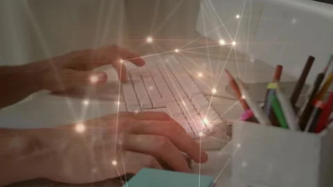 Glowing network of connections against mid section of a person using computer at 스톡 동영상 328829708