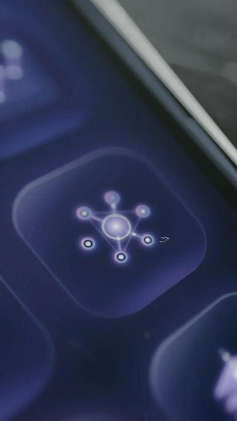 Glowing network node symbol appears on a purple mobile dashboard button Stockbeeldmateriaal 342488382