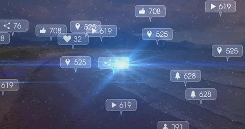 Glowing notification bubbles floating on beach at night, showing numeric badges Stock Photos