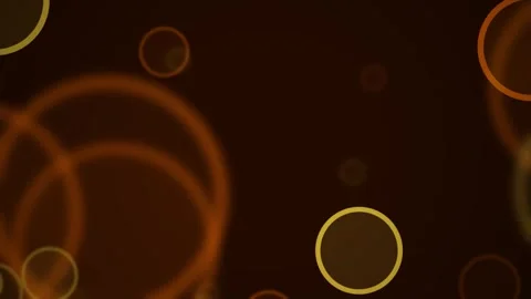 Glowing orange bokeh circles floating gently in dark warm atmosphere with c.. Video stock 344285704