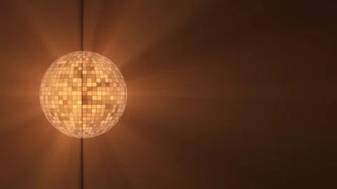 Glowing orange disco ball with rays of light. Animation of rotation and glow of Stock Footage 265029437