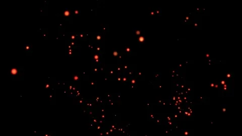 Glowing orange embers floating up from bottom on black background Stock Footage 327499759