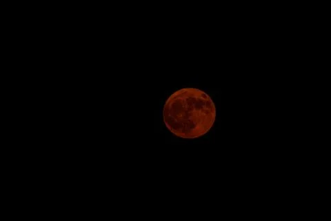 Glowing Orange Full Moon in an Empty Black Sky Stock Photos