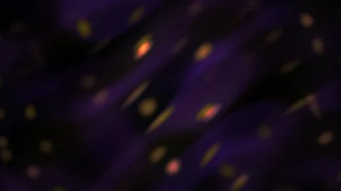 Glowing orange particles on dark background with purple hue. Stock Footage 335523642