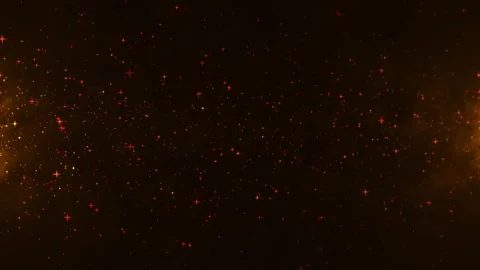 Glowing orange particles drift across a dark background, creating a warm cosm Stock Footage 331997412
