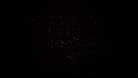 Glowing orange particles swirl dynamically against a deep black background Stock Footage 329305428