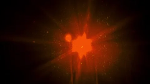 Glowing orange star bursts through a dark field of space, Cosmic explosion .. Stock Footage 346559564