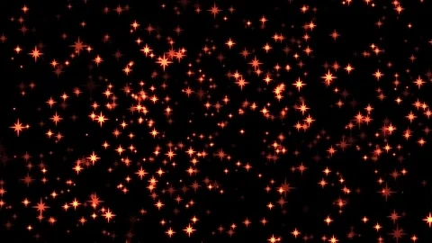 Glowing orange star particles gently float up against black Stock Footage 327510779