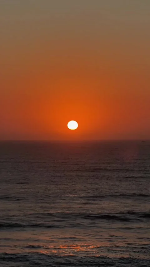 Glowing Orange Sun Setting Over Atlantic Ocean. Stock Footage 328045313
