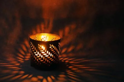 Glowing ornamental lantern with candle Stock Photos