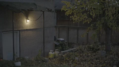 Glowing outdoor light on the side of an old building Stock Footage 226442200