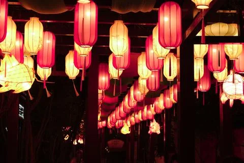 Glowing paper lanterns in a dark corridor Stock Photos