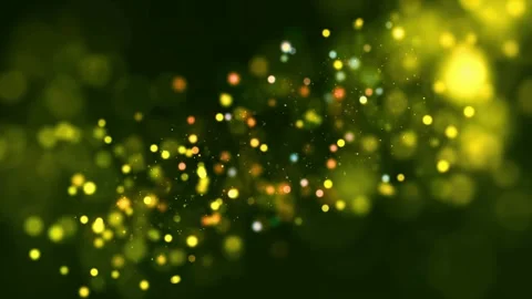 Glowing particles on dark background. Bokeh lights in green and yellow hues Stock-Footage 334308711
