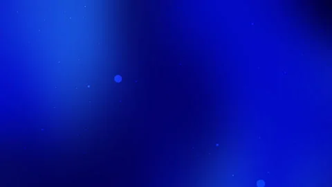 Glowing particles drift across a dark blue background. Stock Footage 303694877