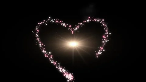 Glowing particles form heart shape with sparkling light Stock Footage 338216890