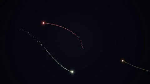 Glowing particles streak through a dark, empty night sky Stock Footage 331644277