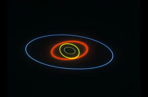 A glowing pattern of laser lights against a black background Stock Photos