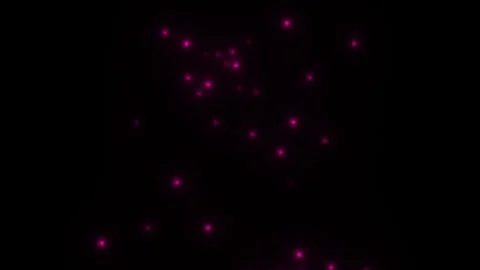 Glowing pink dots on a dark background create a lively Stock Footage 338316723