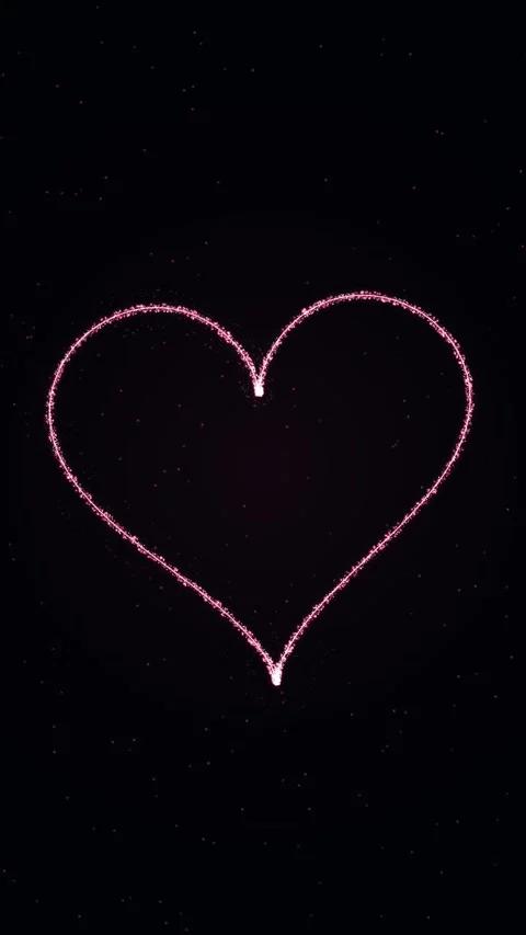 Glowing pink light trail forms a heart shape against a dark background Stock Footage 345184789