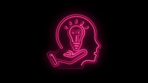 Glowing pink neon light bulb inside human head silhouette held by hand Stock Footage 333951853