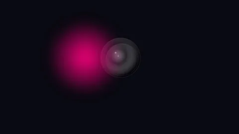 A glowing pink orb casting light next to a dark spherical object in space Stock-Footage 338311233
