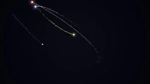 Glowing points and trails against a dark starfield Stock Footage 331645016