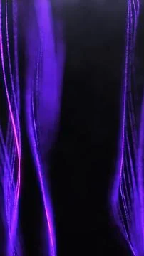 Glowing purple light waves moving across a deep black background Stock Illustration