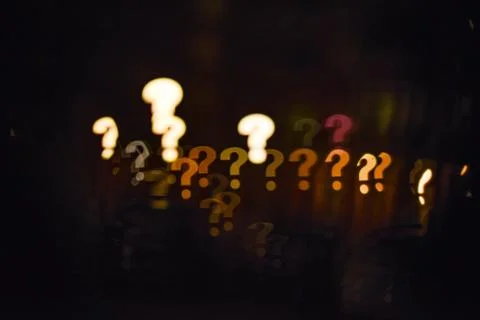 Glowing question marks qustom bokeh. Question concept. City street lights Stock Photos