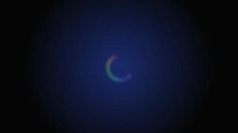 A glowing rainbow gradient loading circle against a deep dark blue background Stock Footage 339617165