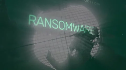 Glowing ransomware text crossing wireframe globe, floating binary code and Stock Footage 307461935