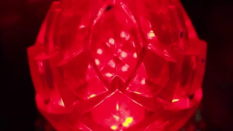 Glowing red crystal-like lamp casting vibrant light, intense and mystical Stock Footage 270130368