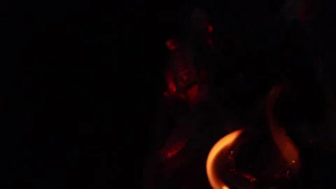 Glowing red embers in dark firewood Stock Footage 336532353