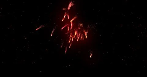 Glowing red firework exploding on black background with defocussed blue spots イラスト素材