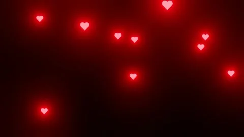 Glowing Red Hearts Falling on Dark Background Stock Footage 311195564