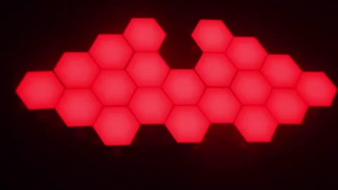 Glowing red hexagon LED wall light pattern on black background Stock Footage 326440464