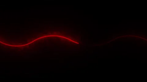 Glowing red light abstract energy pulse moving across horizontal waveform l.. Stock Footage 333878265