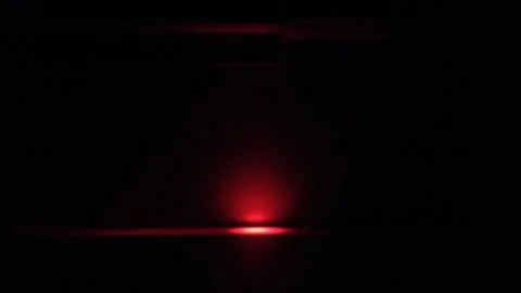 Glowing red light. Black background. Mysterious minimalist abstract Stock Footage 259298262
