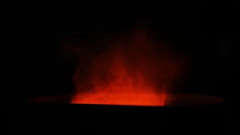 Glowing Red Light Stick with Swirling Smoke, A glowing red light stick emit.. Stockbeeldmateriaal 304961682