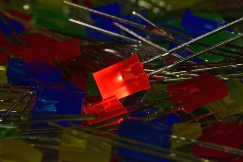 Glowing red-power semiconductor LED in a rectangular plastic case Stock Photos