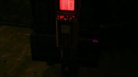 Glowing Red Screen of a Technical Device in a Dark Room at Night Stock Footage 348159016