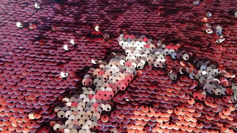 Glowing red sequins background with copy space Stock Photos
