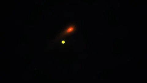 Glowing red spot in a dark background with yellow circle. Stock Footage 335960438