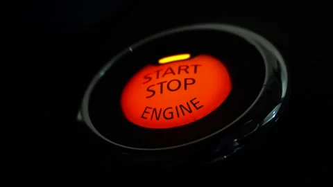 Glowing Red Start Stop Engine Button on Dashboard in Dark Car Interior Vídeo Stock 347269588