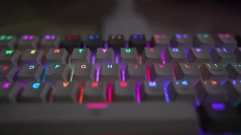 Glowing RGB computer mechanical keyboard rotated viewing footage Stock Footage 290944764
