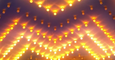 Glowing Rows of colorful orange ceiling lights in a zig-zag pattern blinking Stock Footage 152488865