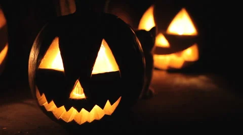 Glowing scary pumpkin at night on the steps 스톡 동영상 68204258